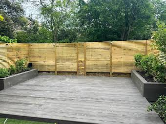 Millboard Urban slate, Venetian slatted fencing, new planters. Clapham SW4.  album cover