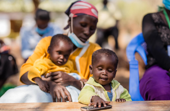 Josephine Kericho’s sons, now healthier, playing with her phone in the ATPU facility where there were born in Isiolo County, Kenya.