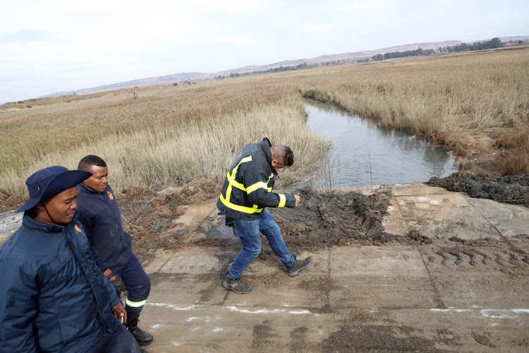 Emergency rescue workers during the search of Khayalethu Magadla, 6, in Soweto.
