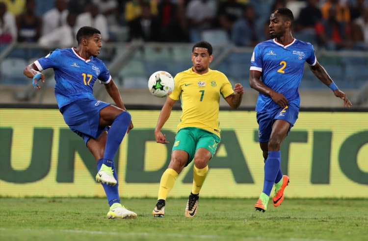 Keagan Dolly of South Africa is challenged by Steven Pereira (L) and Ianique dos Santos of Cape Verde during the 2018 FIFA World Cup Qualifier match between South Africa and Cape Verde at Moses Mabhida Stadium on September 05, 2017 in in Durban, South Africa.