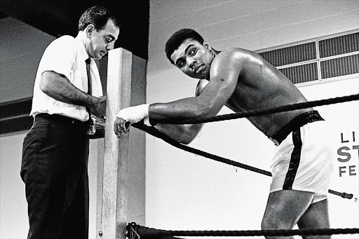 Muhammad Ali with Angelo Dundee ahead of a fight. File photo.