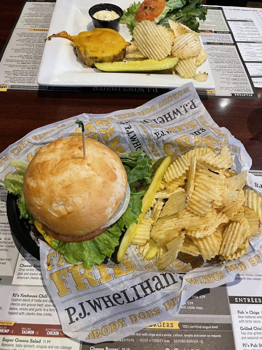 Cheeseburger with an UDI's bun, chips, and a pickle