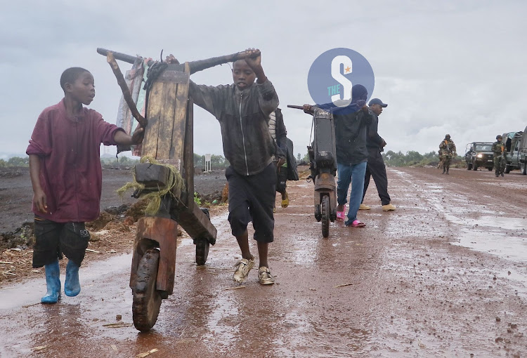 Traders at Goma Kibumba Rumagambo road heading to a local market to sell and buy food stuff in Goma on April 18 2023. Kenya Defence Forces has been in Eastern DRC since November 12, 2022 under the regional force EACRF to restore peace and stability in the war torn country.