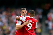 Granit Xhaka of Arsenal interacts with Gabriel Jesus of Arsenal after being substituted during the Premier League match against Tottenham Hotspur at Emirates Stadium on October 01.