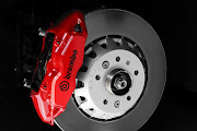 Front brakes feature bi-material brakes with Red Brembo calipers.