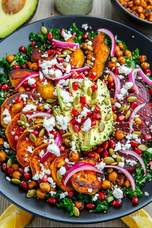 Roast Acorn Squash, Sweet Potato and Beet Kale and Quinoa Salad with Avocado, Feta and Pomegranate in a Cilantro Lemon Tahini Dressing