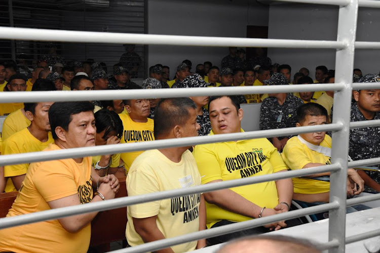 Members of the Ampatuan family sit with other suspects in the 2009 Maguindanao Massacre at the promulgation of the case in the Supreme Court of the Philippines. Picture: PUBLIC INFORMATION OFFICE VIA REUTERS