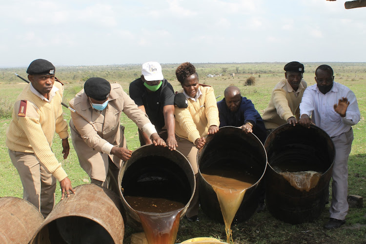 Athi River administrators pour out illicit brew that was found in County village on February 12, 2021