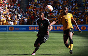 Orlando Pirates striker Vincent Pule takes on Kaizer Chiefs's Zitha Kwinika during the DStv Premier League match between the Soweto giants at the FNB Stadium in Johannesburg.