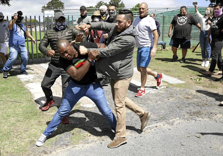 Parents and community members clash with EFF members at Brackenfell High School in November. The EFF was protesting against alleged racism at the school after a private party was attended by whites only.