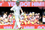 South Africa captain Dean Elgar walks off the field after being dismissed by Mitchell Starc of Australia for 3 on day one of the first Test at The Gabba in Brisbane on December 17 2022. 