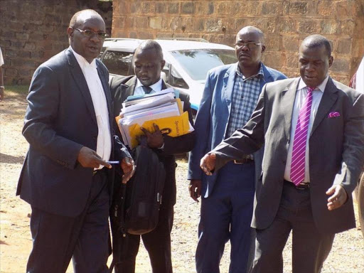 Lawyer Sonye Ondari and petitioner Lumumba Nyaberi outside the Kisii High Court, December 6, 2017. /BENSON NYAGESIBA