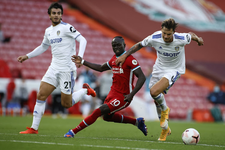 Sadio Mane of Liverpool battles for possession with Robin Koch of Leeds United during the Premier League match between Liverpool and Leeds United at Anfield on September 12, 2020 in Liverpool, England.