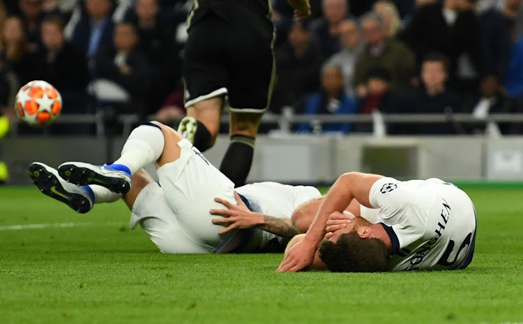 Tottenham's Jan Vertonghen and Toby Alderweireld lie down injured