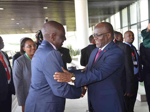 Tanzanian President John Magufuli welcomes DP William Ruto in Dar for the EAC extraordinary summit yesterday /DPPS