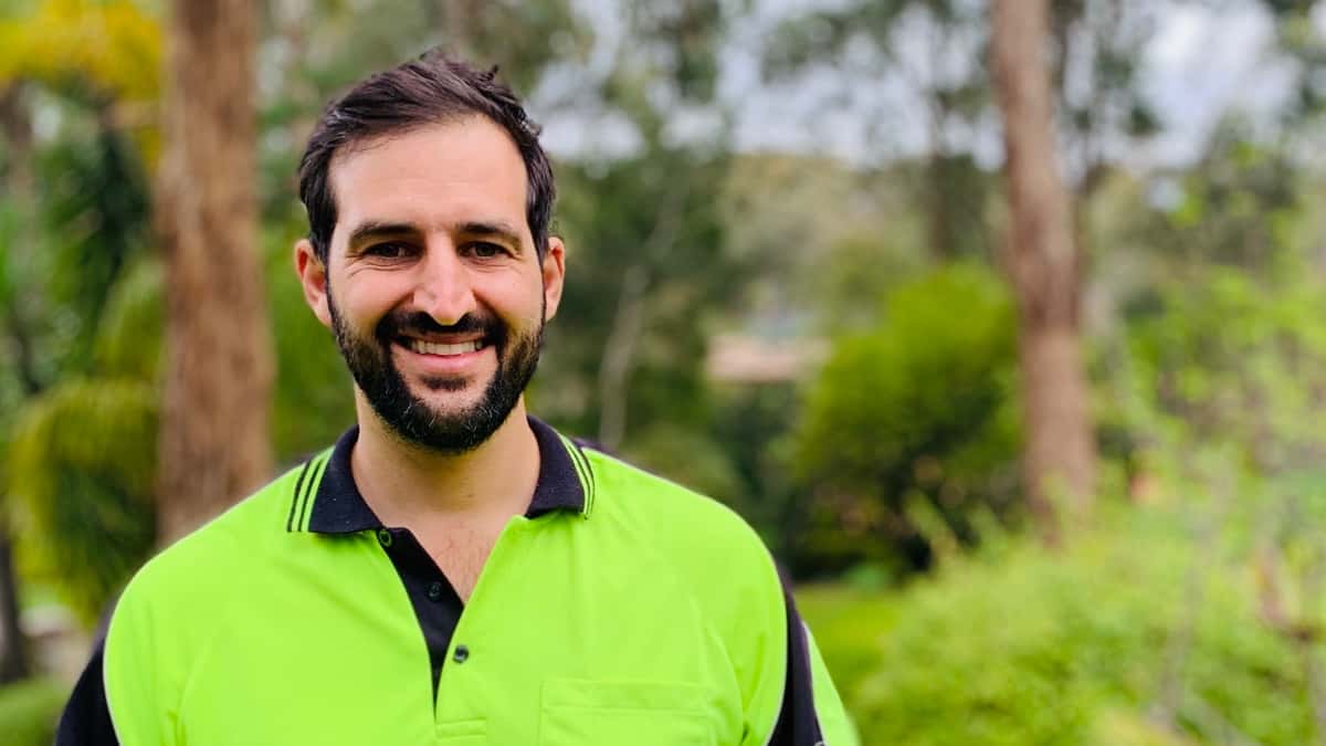 Daniel Hunt portrait photo with trees in the background