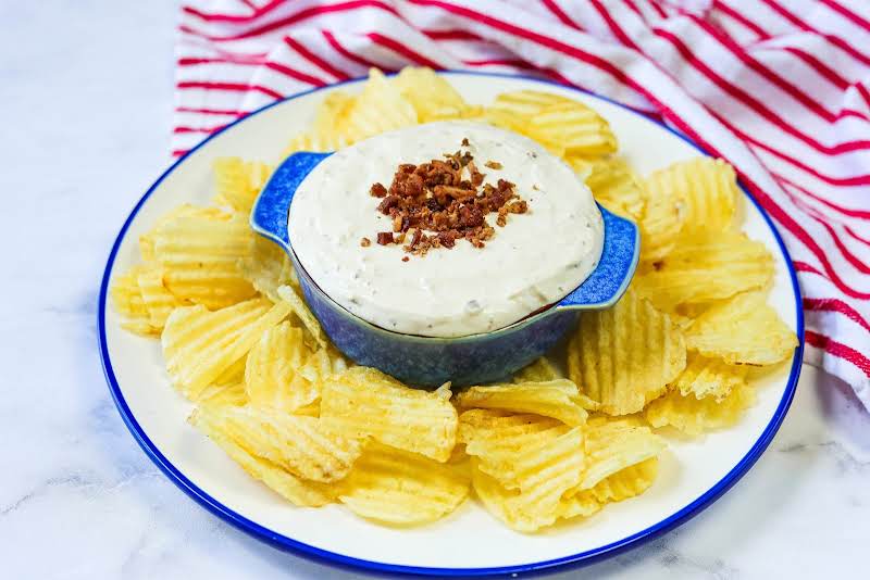 Bacon Horseradish Dip In A Serving Bowl With Chips.