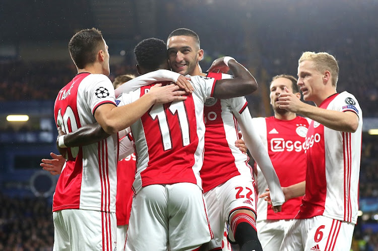 Quincy Promes of AFC Ajax celebrates with teammates after scoring his team's first goal during the UEFA Champions League group H match between Chelsea FC and AFC Ajax at Stamford Bridge on November 05, 2019 in London, United Kingdom.