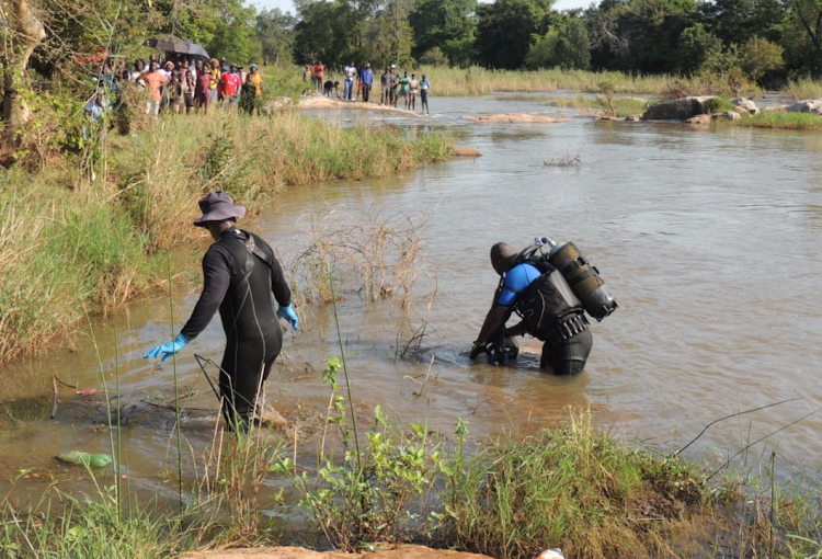 The body of a 27-year-old man who drowned during a baptism was retrieved from the river by police divers.