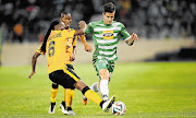 TOE-TO-TOE: Reneilwe Letsholonyane of Kaizer Chiefs and Keegan Ritchie of Bloemfontein Celtic let their feet do the talking during their sides' Absa Premiership match at Free State Stadium, Bloemfontein, last night