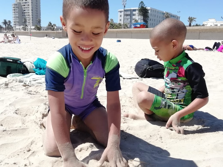 Having fun at the beach, brothers Azaan Jafta, 4, (left) and Liam Prinsloo, 5, spend their second school holiday at Pollock beach in Summerstrand.