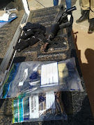 Guns, explosives and ammunition seized by police in a series of raids across Gauteng in which 23 suspected cash-in-transit robbers were arrested.