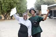 Tshegofatso Kgatla and Magale Rampheri receive their matric results for the Class of 2022 at Kwa-Bhekilanga Secondary School in Alexander, Johannesburg.