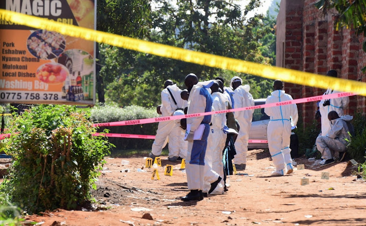 Ugandan explosives experts secure the scene of an explosion in Komamboga, a suburb on the northern outskirts of Kampala, Uganda on October 24, 2021.