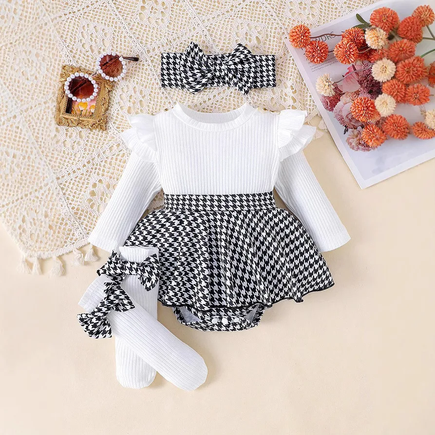 Eendelig romper met ingezonken gestreepte lange mouwen, houndstooth rok en stiksels - comfort en stijl in één.