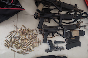 Some of the recovered firearms and ammunition.