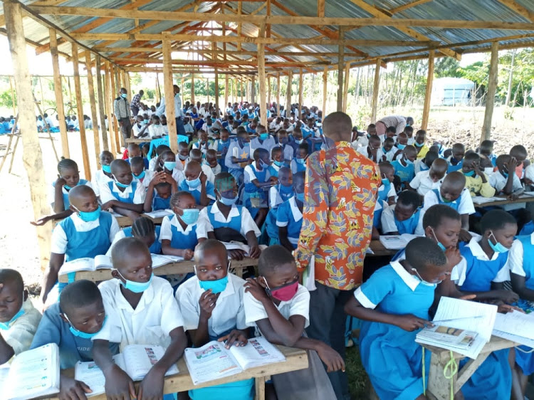 Teachers position themselves in respective classroom during lessons time at Ogenya Primary School in Nyando conduct their lessons on January 4, 2021.