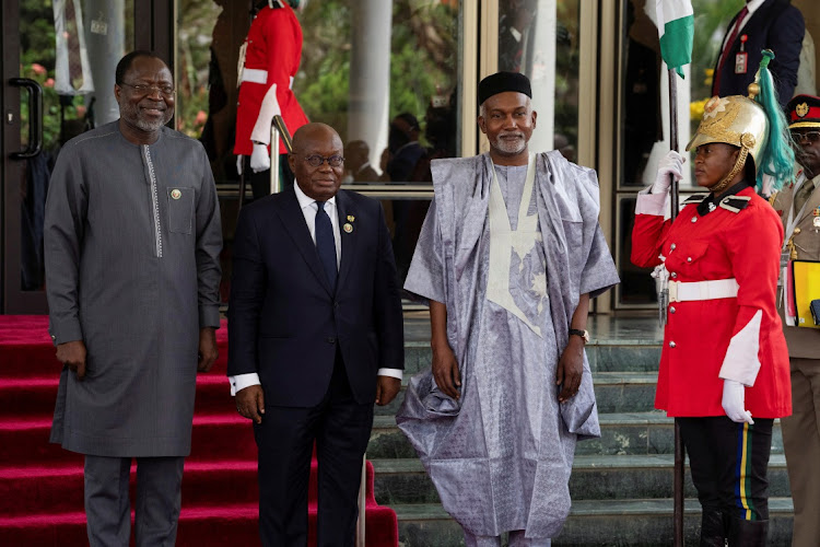 Ghana's President Nana Akufo-Addo, centre, is received by Ecowas president Omar Alieu Touray, left, and Nigerian foreign minister Yusuf Tuggar in Abuja, Nigeria, February 24 2024. Picture: MARVELLOUS DUROWAIYE/REUTERS