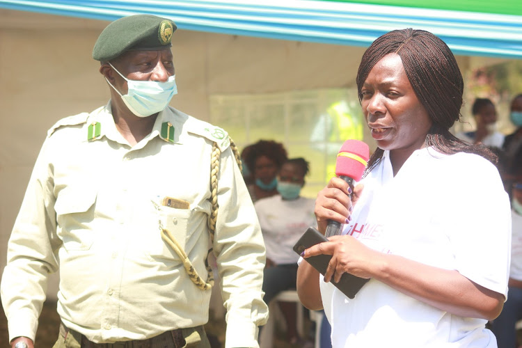 WORLD HABITAT DAY CELEBRATIONS: Kenya ecosystem conservator Joseph maina with Winam Grassroots Founder and Director Mary Were Opot during tree planting at Nyanza Golf Club in Kisumu on Monday. More than 500 trees were planted.