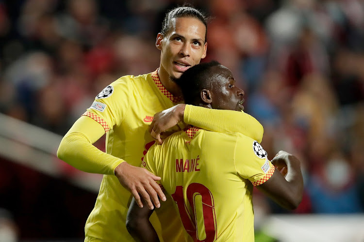 Virgil van Dijk (left) of Liverpool congratulates Sadio Mane on his goal in the Uefa Champions League match against Benfica at Estadio Da Luz in Porto, Portugal on April 5 2022.