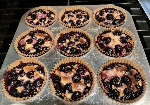 Baked Blueberry Cream Cheese Cups in muffin tin.  