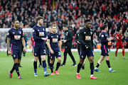 Bournemouth players cut a dejected figure as they walk off the pitch after a Premier League defeat to Liverpool at Anfield on March 7 2020. Bournemouth confirmed on Sunday May 24 2020 one of their players has tested positive for the Covid-19 disease. 