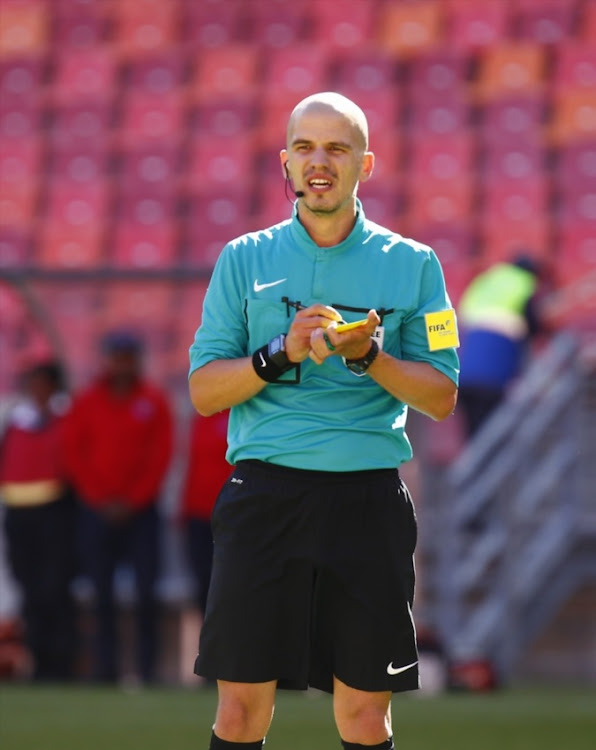 Victor Gomes match referee writes up a yellow card during the Absa Premiership match between Chippa United and Cape Town City FC at Nelson Mandela Bay Stadium on November 19, 2016 in Port Elizabeth.