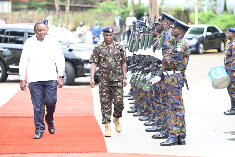 President Uhuru Kenyatta with Chief of Defence Forces General Robert Kibochi during the commissioning of the Kisumu Shipyard on Tuesday, August 2