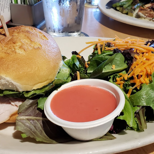 Turkey club on gluten free bun, side salad with raspberry vinaigrette