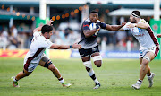 Sikhumbuzo Notshe of the Sharks evades Bordeaux-Begles players during their Champions Cup match at Kings Park on Saturday.