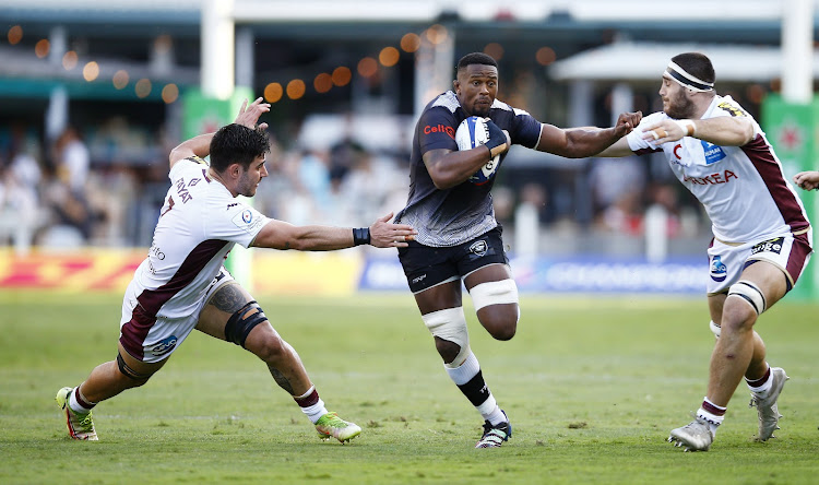 Sikhumbuzo Notshe of the Sharks evades Bordeaux-Begles players during their Champions Cup match at Kings Park on Saturday.