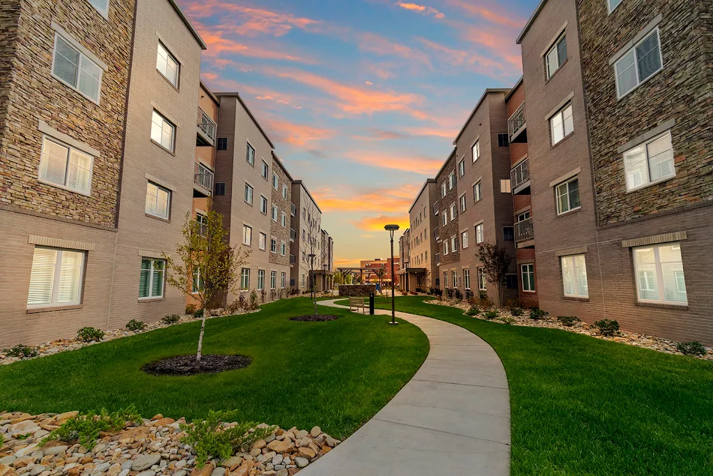 WaterWalk Raleigh RTP apartment building with light stone at dusk