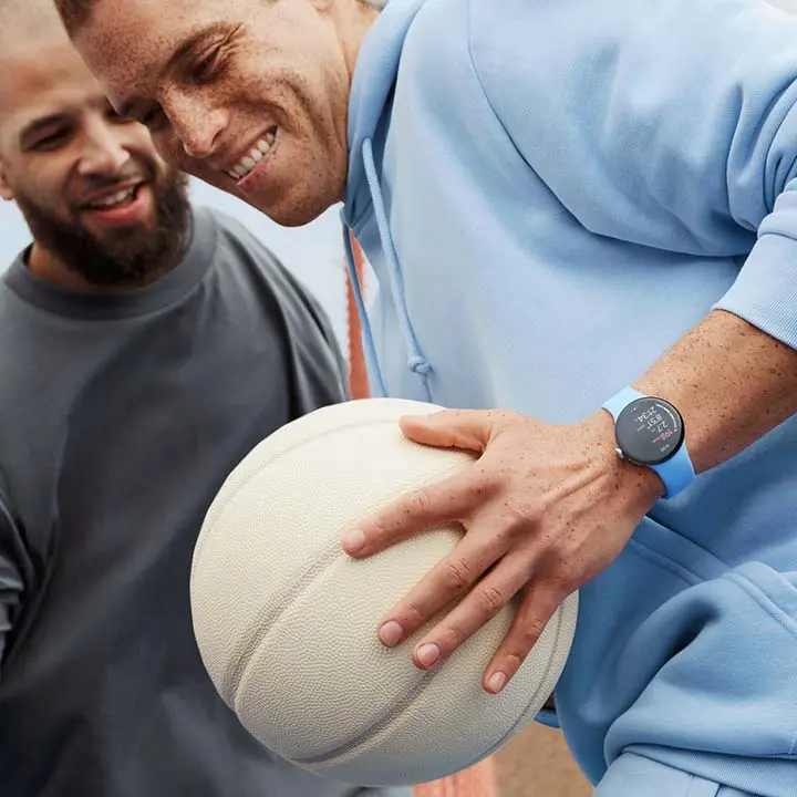 Two basketball players, one wearing a Pixel Watch 2