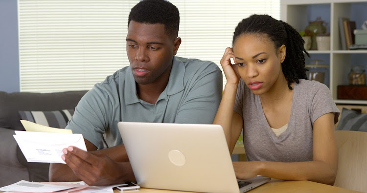 Young couple going over bills and finances.