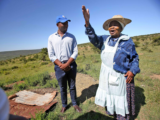 LOOS IN LIMBO: The DA’s Mmusi Maimane with Kwasaki villager Thobeka Mono, 80, who is yet to receive her toilet. Some of her neighbours have but they can’t use them yet Picture: MARK ANDREWS