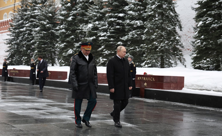 Russia's President Vladimir Putin and Defence Minister Sergei Shoigu attend a wreath laying ceremony marking Defender of the Fatherland Day at the Tomb of the Unknown Soldier by the Kremlin Wall in Moscow, Russia, February 23, 2024.