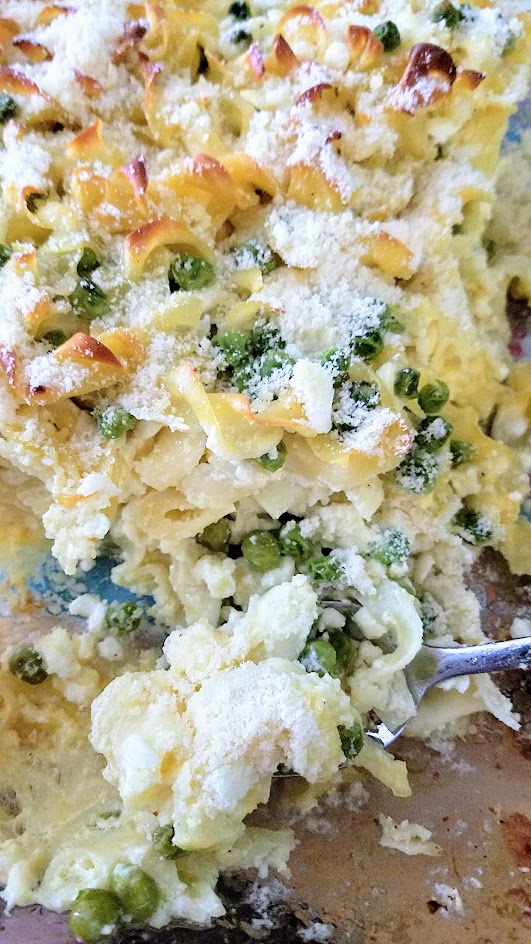 This Savory Cheese Kugel Recipe is my take on the Jewish casserole with egg noodles, butter, eggs, and cheese, with other optional add ins like here, peas and sauteed onions