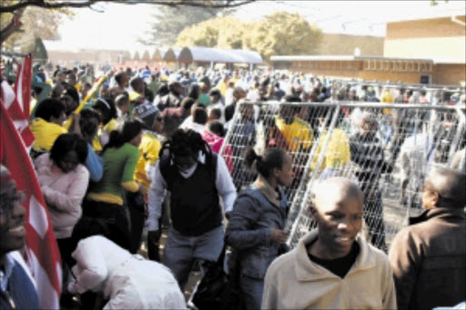 CURIOUS MASS: A large number of soccer fans crowded into the Vaal University of Technology to view the Fifa World Cup trophy when it arrived in the area yesterday. Five people were injured as the crowd jostled to see the prized object. Pic: LEN KUMALO. 03/06/2010. © Sowetan.