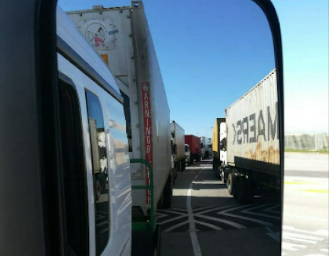 A long line of trucks at the container terminal