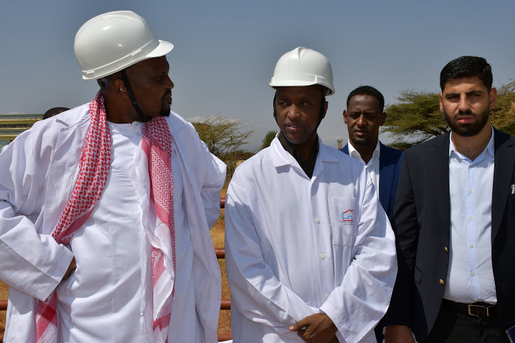 Trade and Investment CS Moses Kuria and Isiolo Governor Abdi Hassan Guyo at the abattoir in Isiolo on July 26, 2023